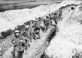 Soldiers of the King’s Liverpool Regiment walking through a trench near Blairville Wood on the Western Front in 1916 during the First World War