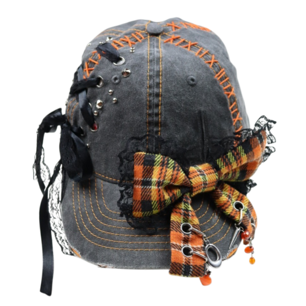grey cap with big orange bow