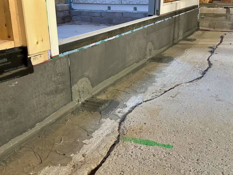 The space in between the shims has been filled with 2 part PU foam and the junction between the Triotherm upstand and the floor has been additionally tanked for Radon protection. 