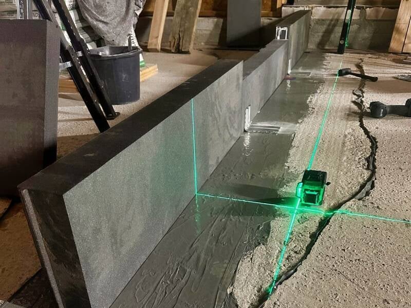 The first Triotherm upstand components have been installed and secured with support brackets towards the inside. 