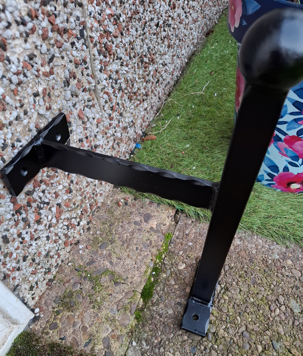 Wall mounted foot scraper