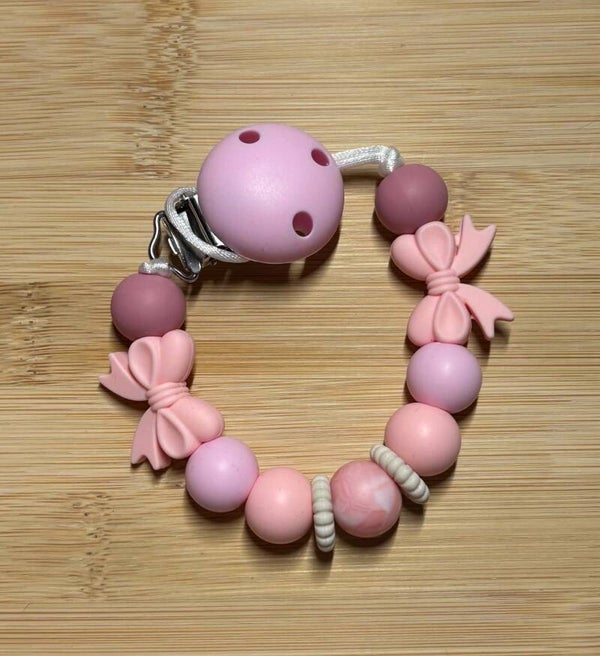 Speenkoord roze strikjes