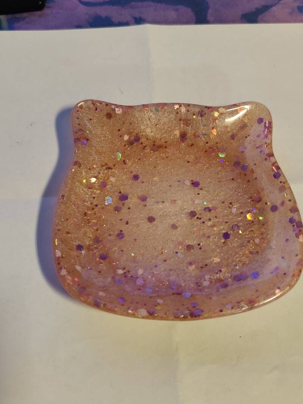 vaaleanpunainen helmiäinen ja glitterinen kissatassi