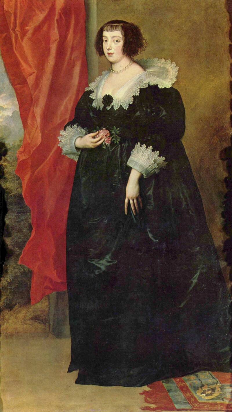 Full length portrait of a young woman with jaw length dark hair wearing a long black dress, with white lace collar and cuffs - painted by Anthony van Dyck in the 1630s.