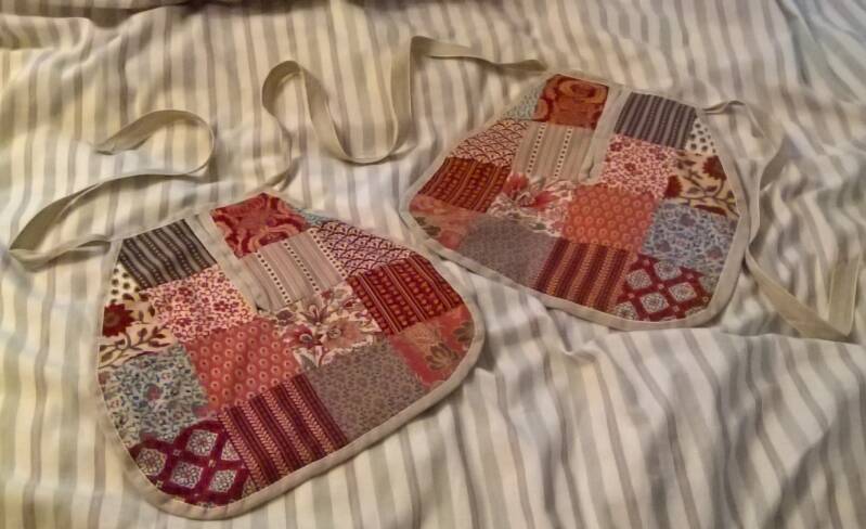 Photo of replica 18th pockets, made from patchwork of various brightly colored fabrics - stripes and florals