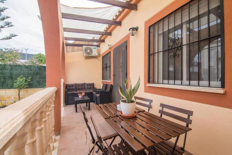 Cozy porch with table to relax and have coffee at Gran Alacant bungalow