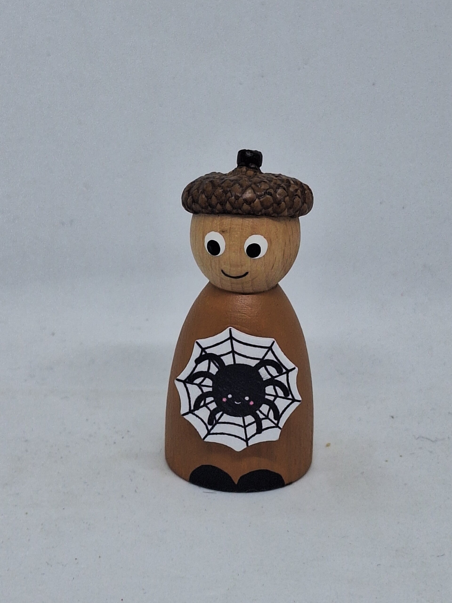 Herfst popje spinnenweb