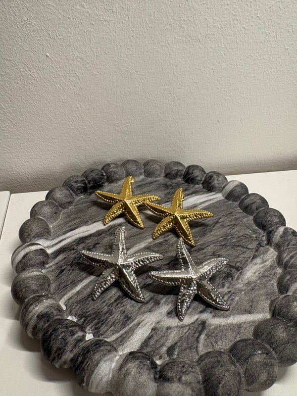 Oorbellen met een zeester in goud en zilver