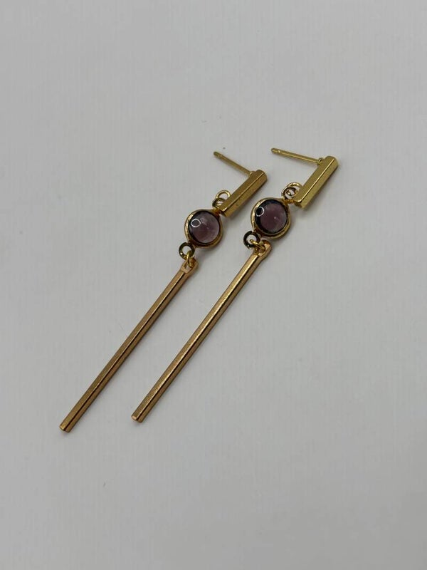 Paarse bolletjes/gouden stokjes