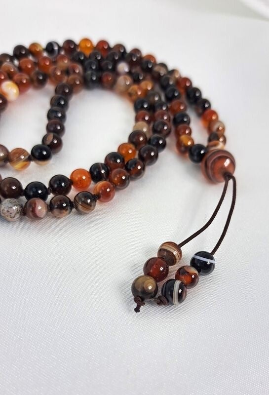 Mala Agate rouge rayée - Confiance et stabilité