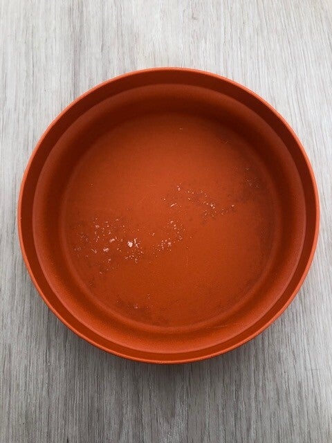 Oranje potje met deksel lichte schade