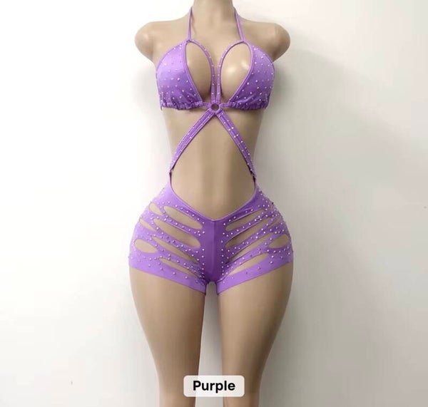 Luxurious rhinestone romper with dramatic side cutouts