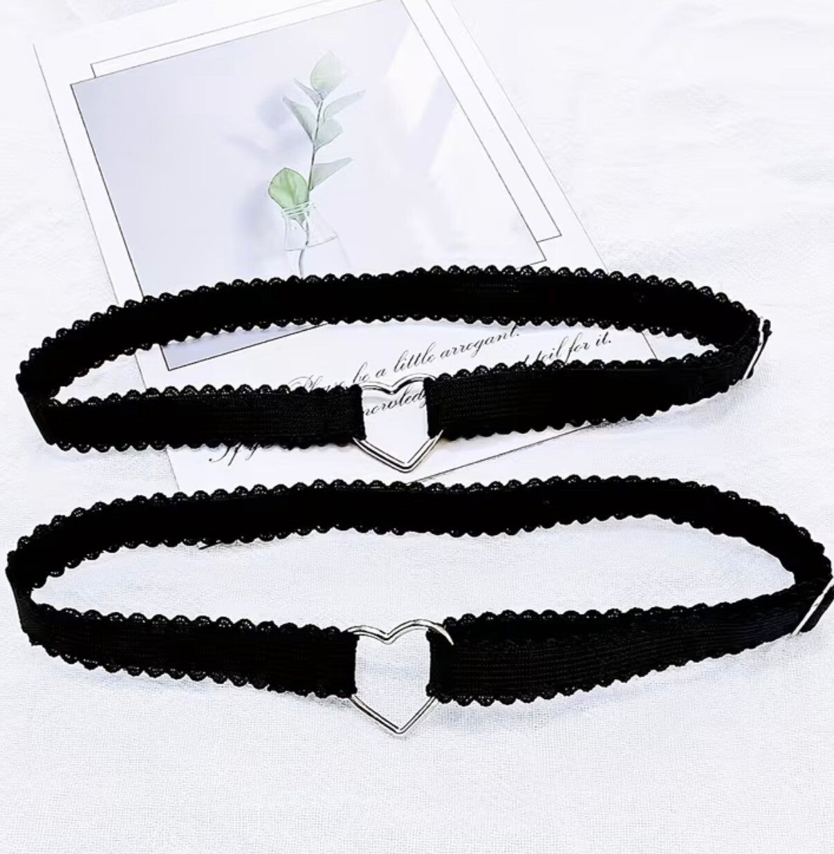 One pair of garters with heart emblem
