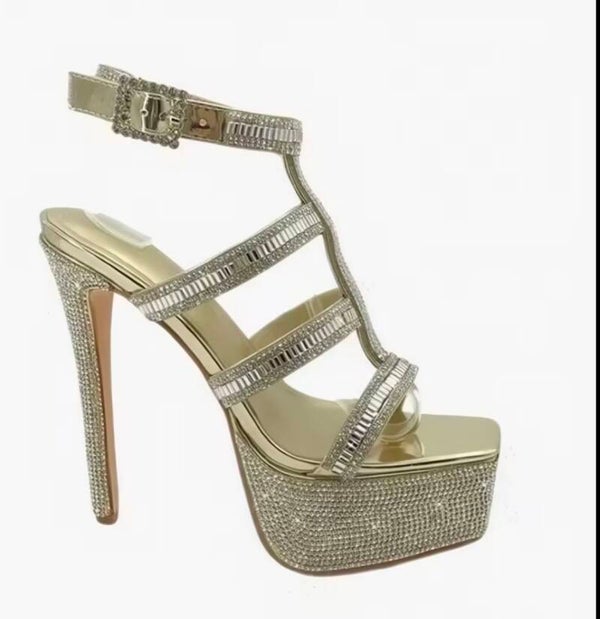Luxury gold rhinestone platform heels with ultra high stiletto heels.