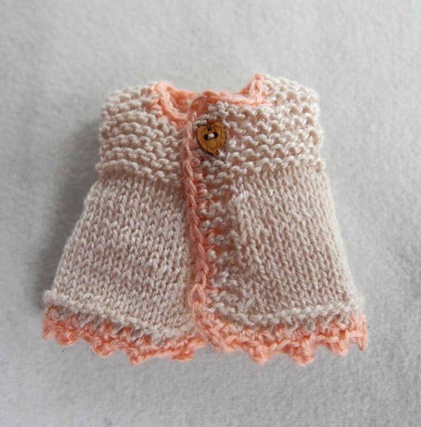 Ecru mouwloos jasje - Ecrut sleeveless cardigan