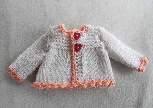Wit jasje met roze boorden - White cardigan with pink edgings