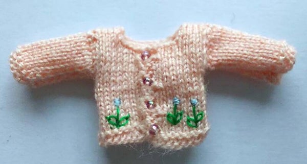 Roze babyvestje met blauwe bloemetjes-Pink baby cardigan with blue flowers