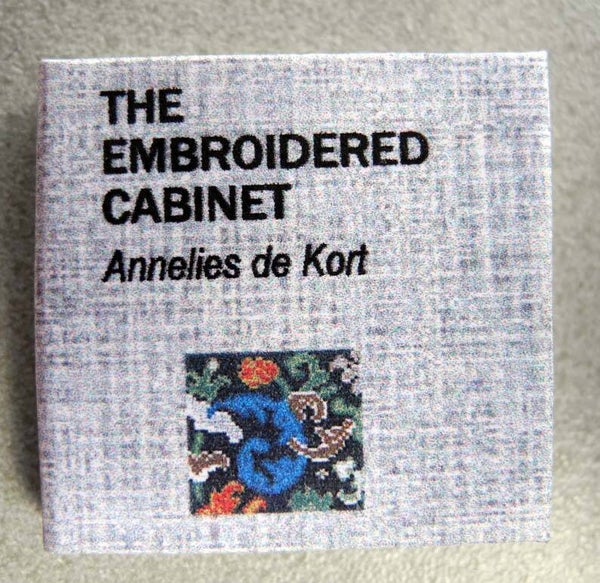 This book is in english - The embroidered cabinet
