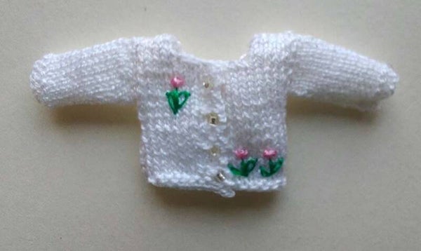 Wit babyvestje met roze bloemetjes-White baby cardigan with pink flowers