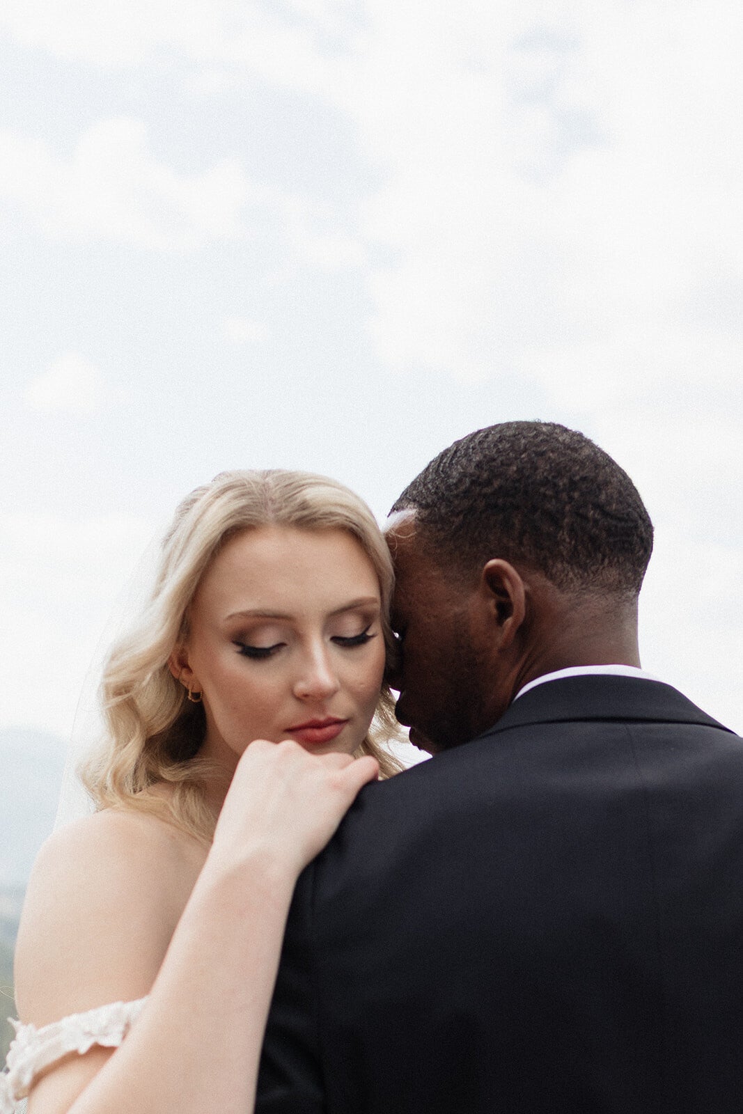 Soft glam bridal makeup for diverse couple wedding at Northstar Gatherings Idaho Springs Colorado