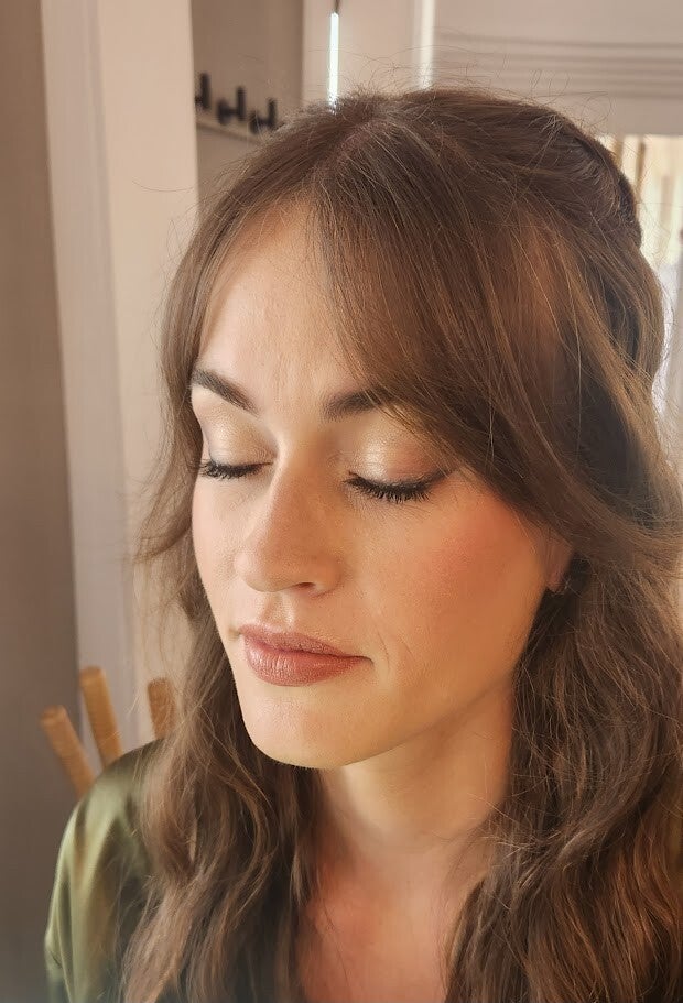 Close-up of a Colorado bride with glowing, skin-first bridal makeup and soft SPF-friendly skincare finish before her wedding in Golden or Black Hawk, Colorado