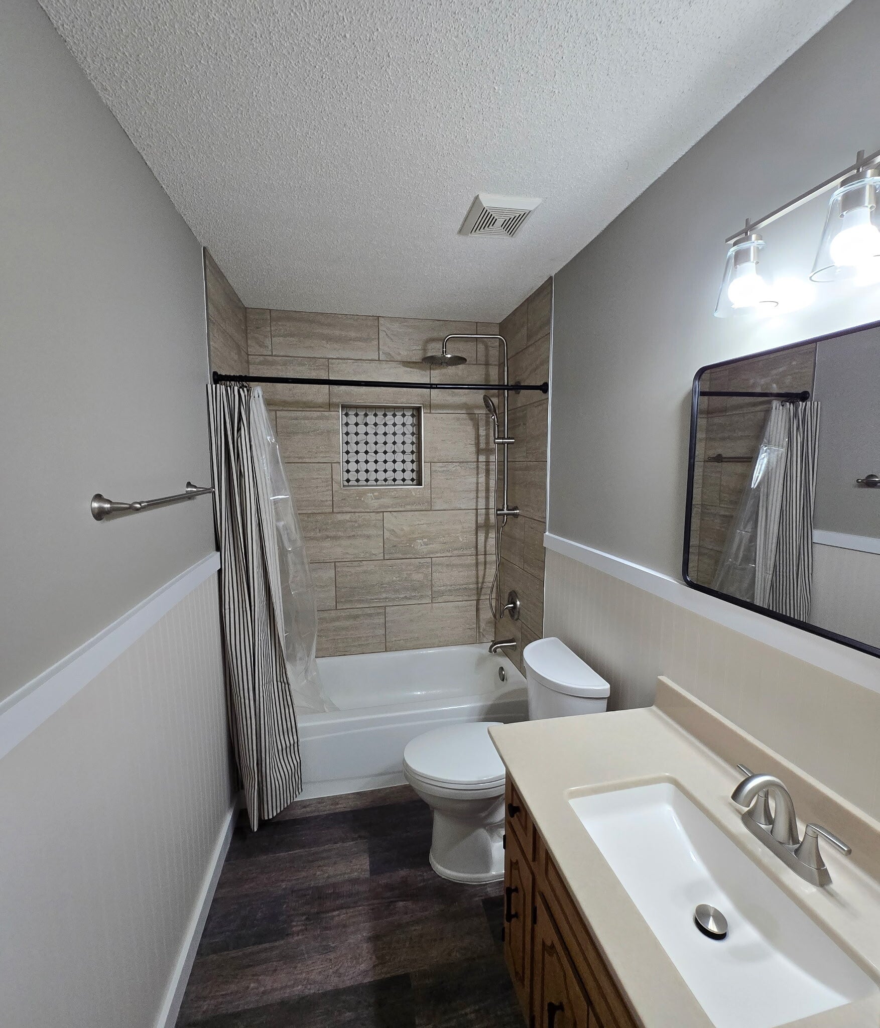 After — tiled tub surround and updated finishes