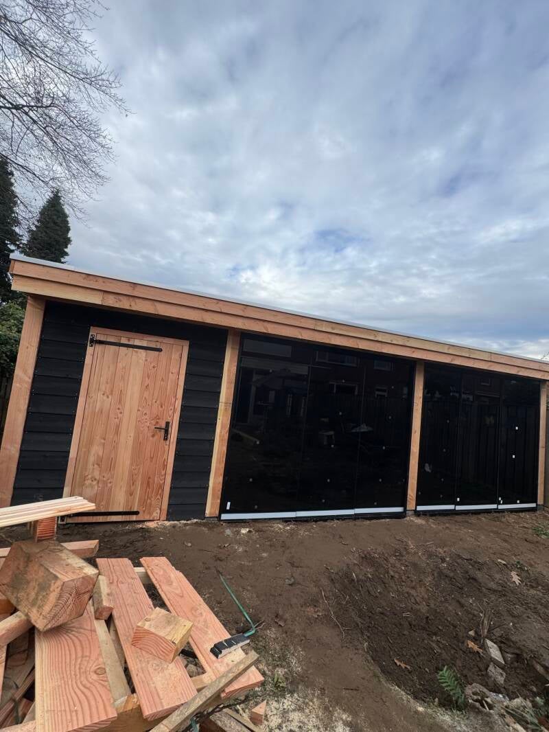 overkapping met glazen wand