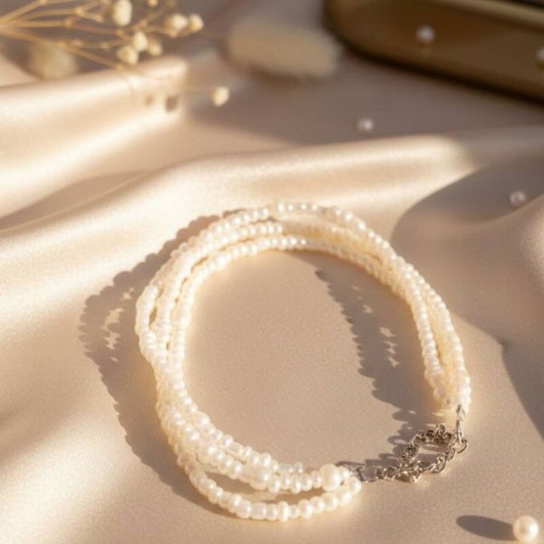 Three-Strand Pearl Bracelet in Soft Cream White – Elara