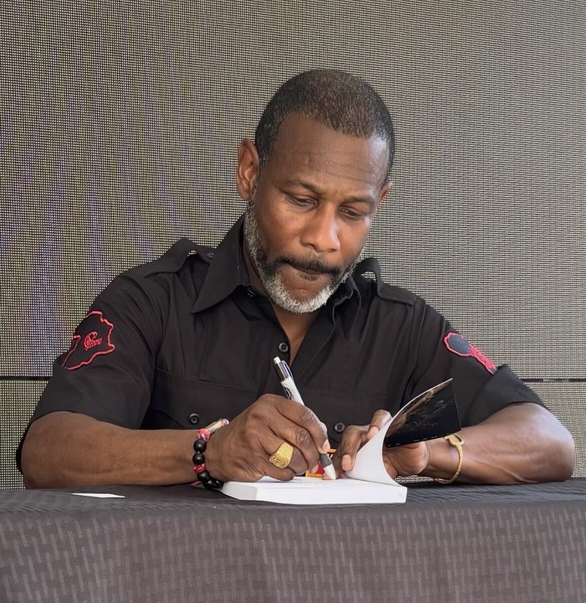 sundiata-signing-a-book-standard-iie2u4.jpg