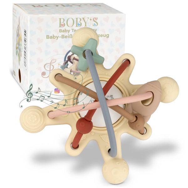 Beißring und Rassel in einer Kombination, die die Aufmerksamkeit des Babys auf sich ziehen