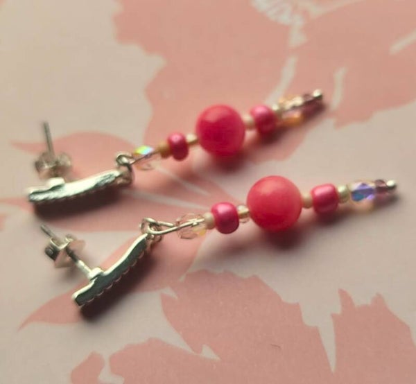 Zilverkleurige stekers met roze glazen parels