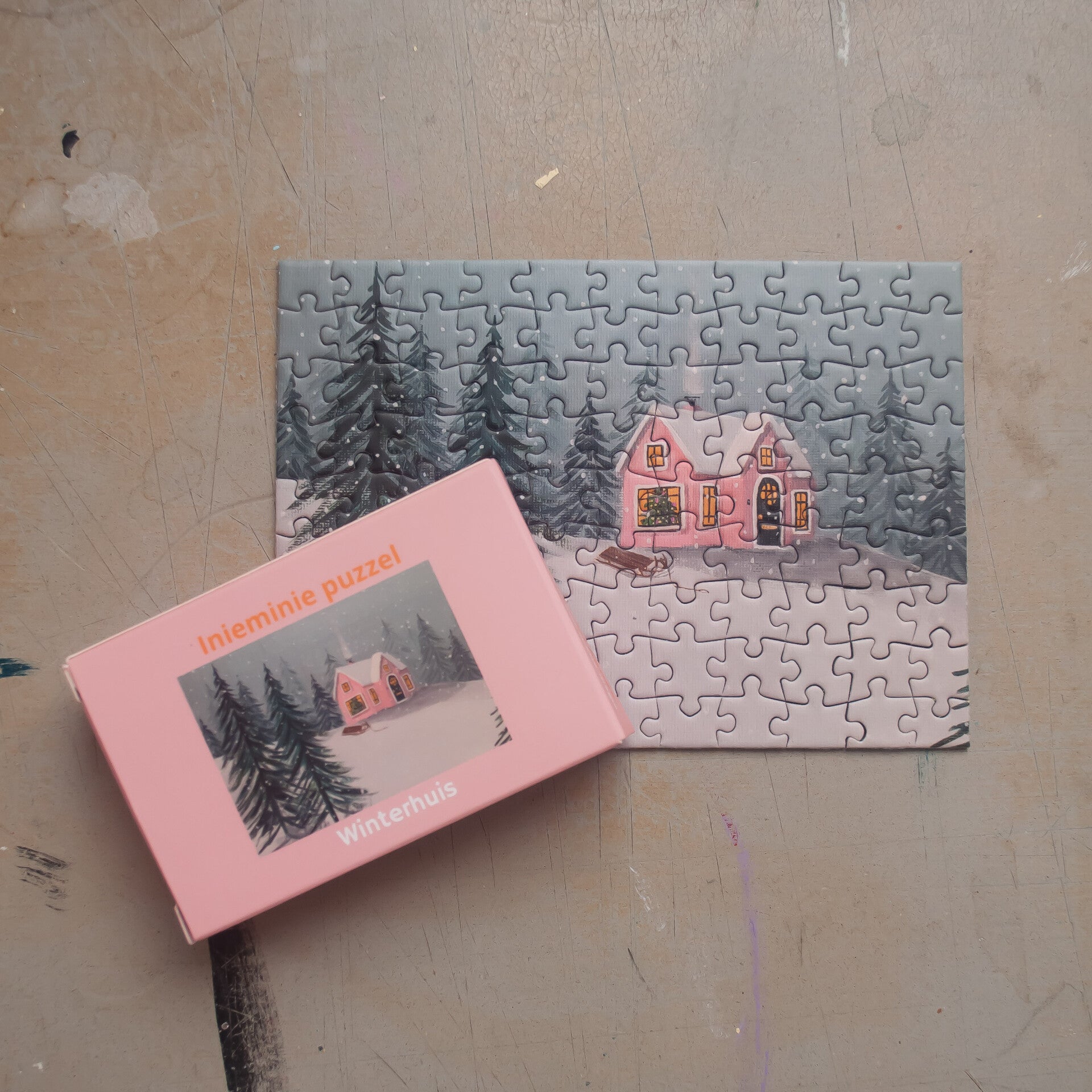 Inieminie puzzel winterhuisje