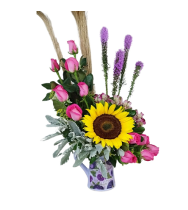 Composición de flores con girasol al centro