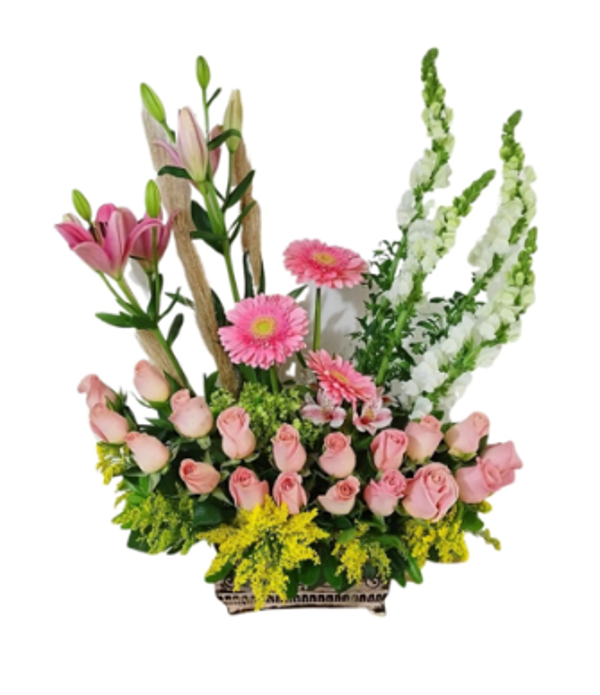 Composición floral de rosas y gerberas + tonos rosados en base de ceramica