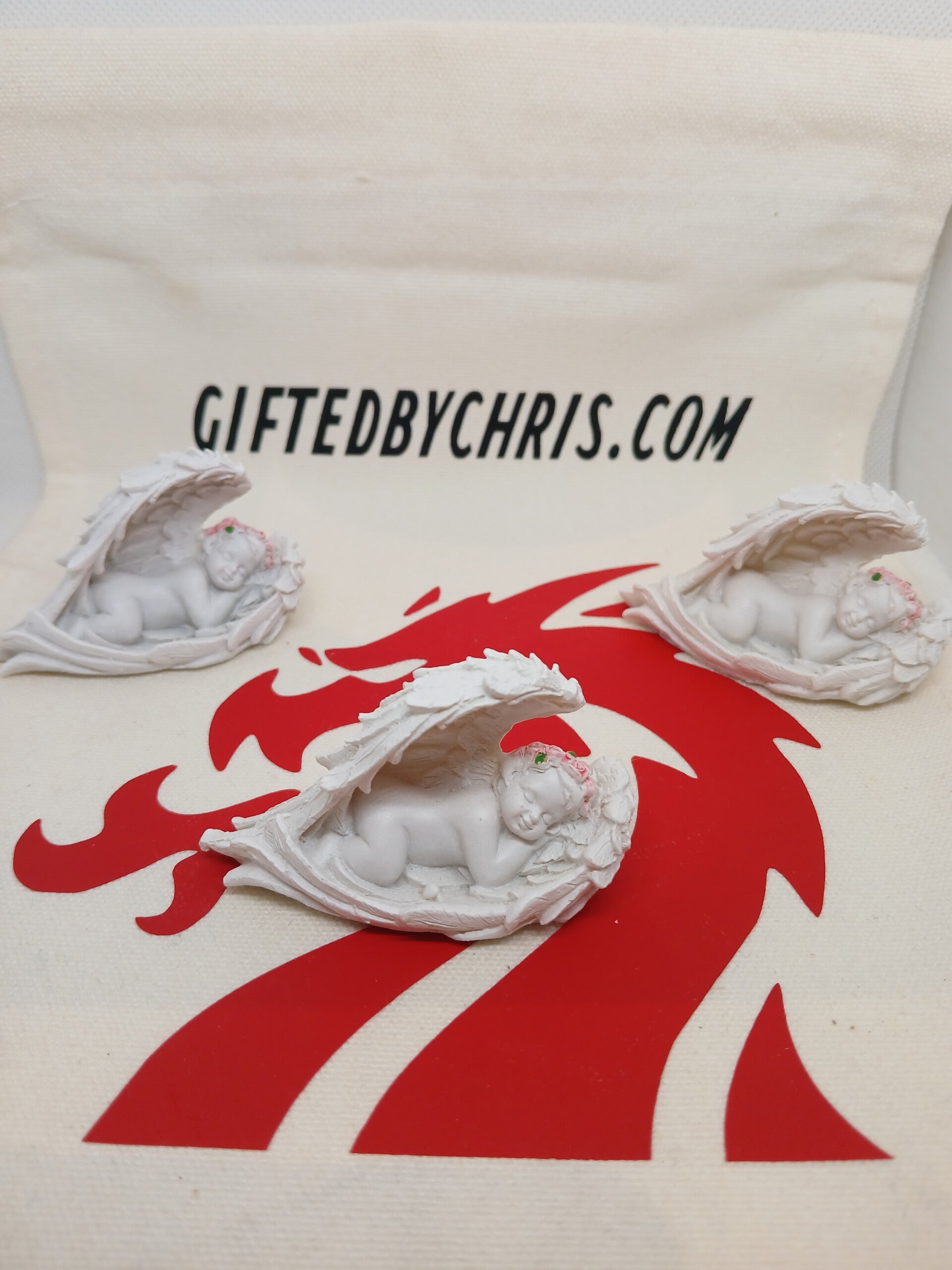 Cherubs Sleeping in Wings with Pink Roses