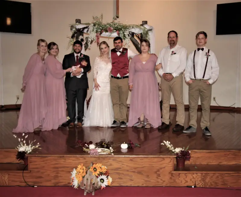 church-wedding-party-photography-rustic-sunflower-altar-decoration-dusty-rose-wedding-colors-family-wedding-chapel-standard.webp