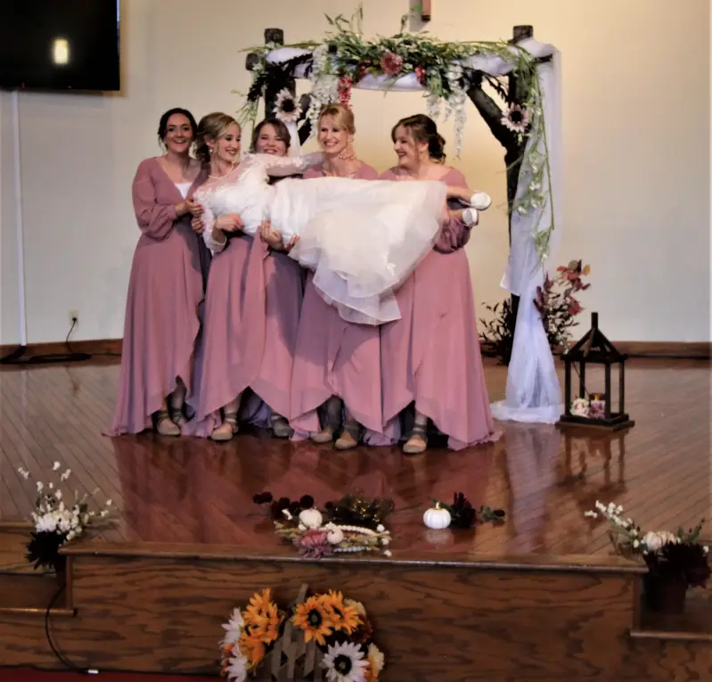 indoor-church-wedding-mauve-bridesmaid-dresses-funny-bridesmaid-photos-east-tennessee-church-wedding-venues-standard.webp