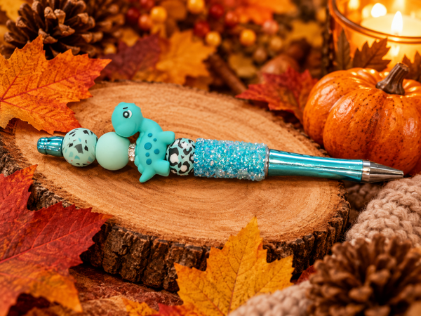 Stylo scintillant dinosaure turquoise