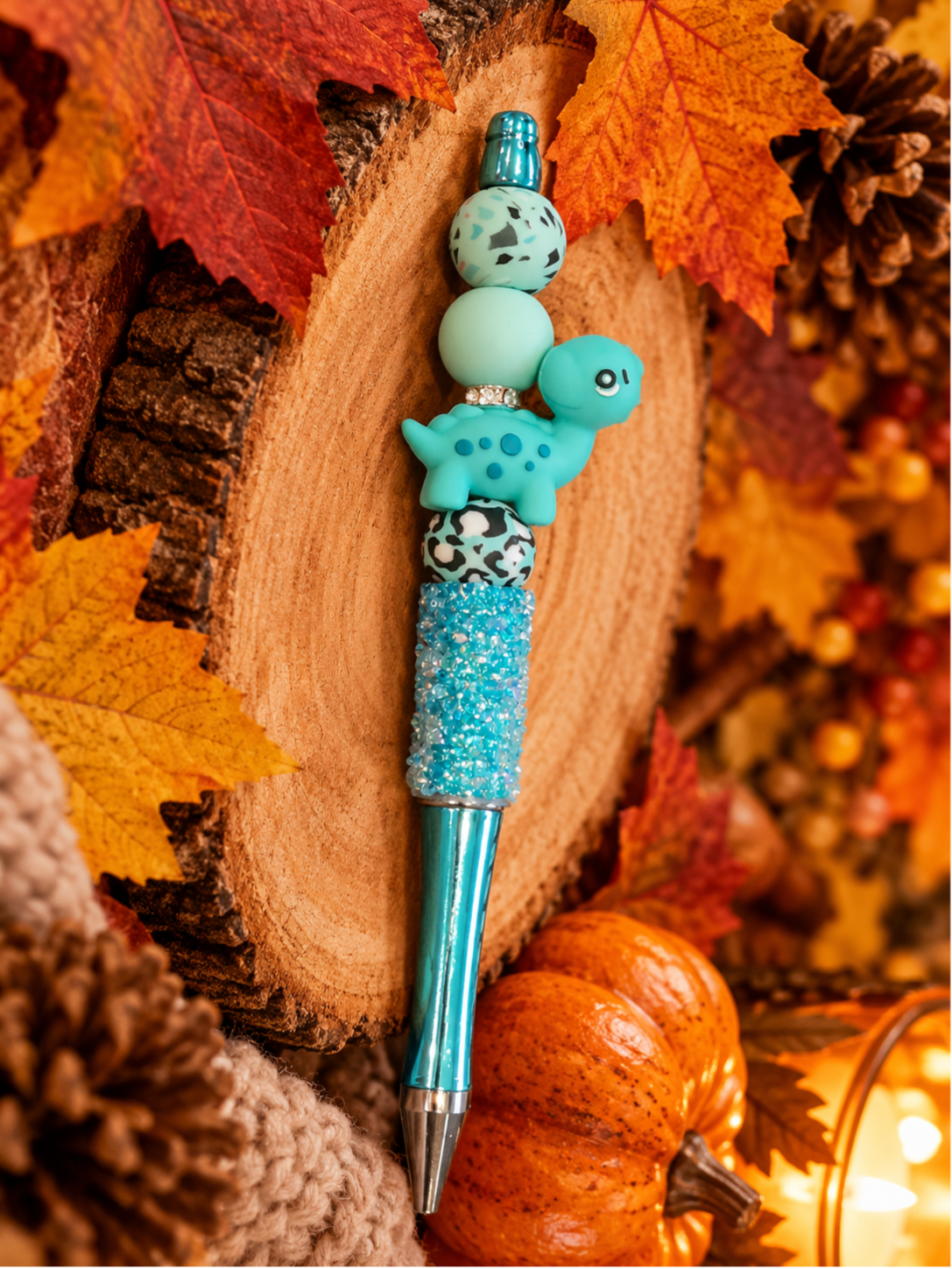 Stylo turquoise pailleté dinosaure