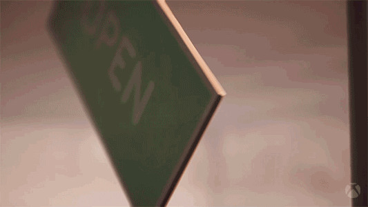 Animated green “OPEN” sign sliding in from the side and facing forward, signalling the shop is open.