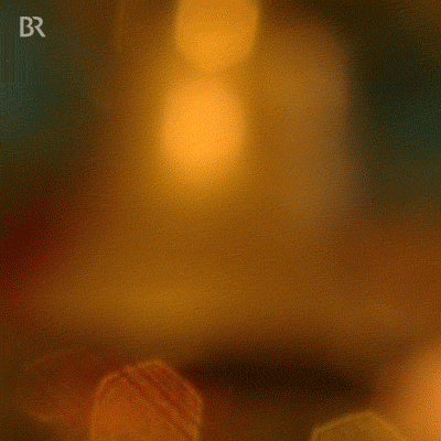 A gif image showing a golden christmas bell ringing with a fade action next to a song peggy lee ring those christmas bells