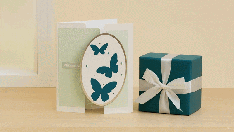 Handmade butterfly card with soft pastel tones, floral accents, and a matching gift box.