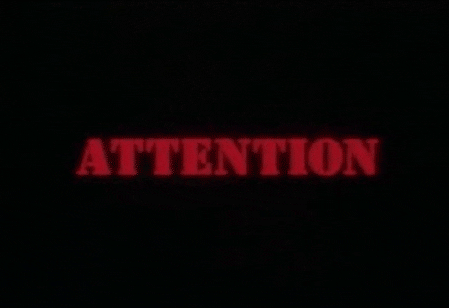 “Animated red ‘ATTENTION’ label drawing focus to the security warning.”