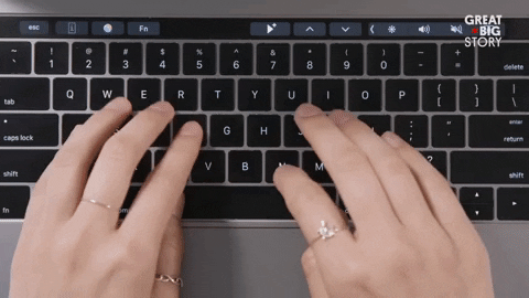 someone typing on a laptop calmly GIF