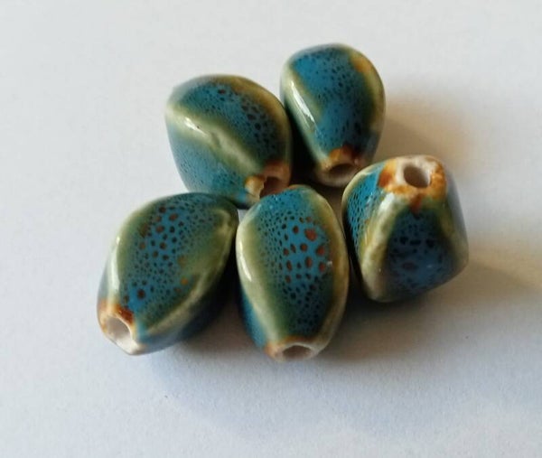 Keramiek kralen turquoise vierkant ovaal 16x11 mm 90084 Va