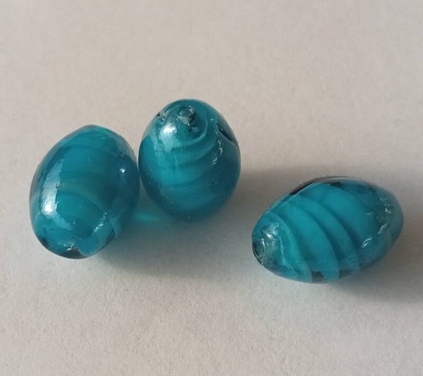 Glaskraal swirl ovaal petrol  16x10 mm 90901 1-2a