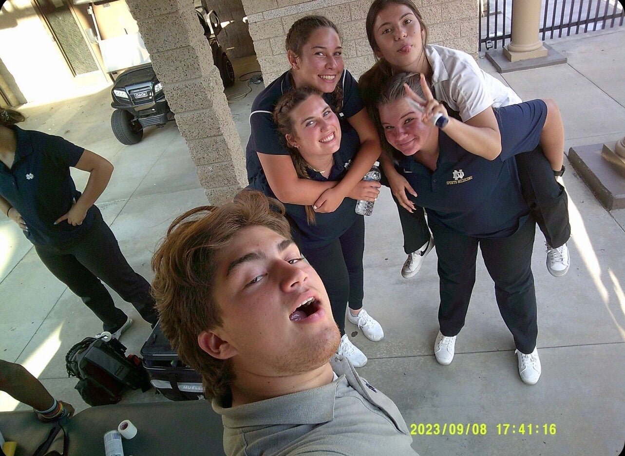 Posing with 4 other friends I met through sports med wearing out school uniforms