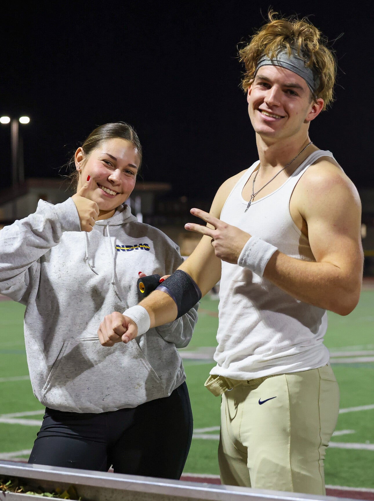 Posing with one of the senior football captains during pregame taping. 