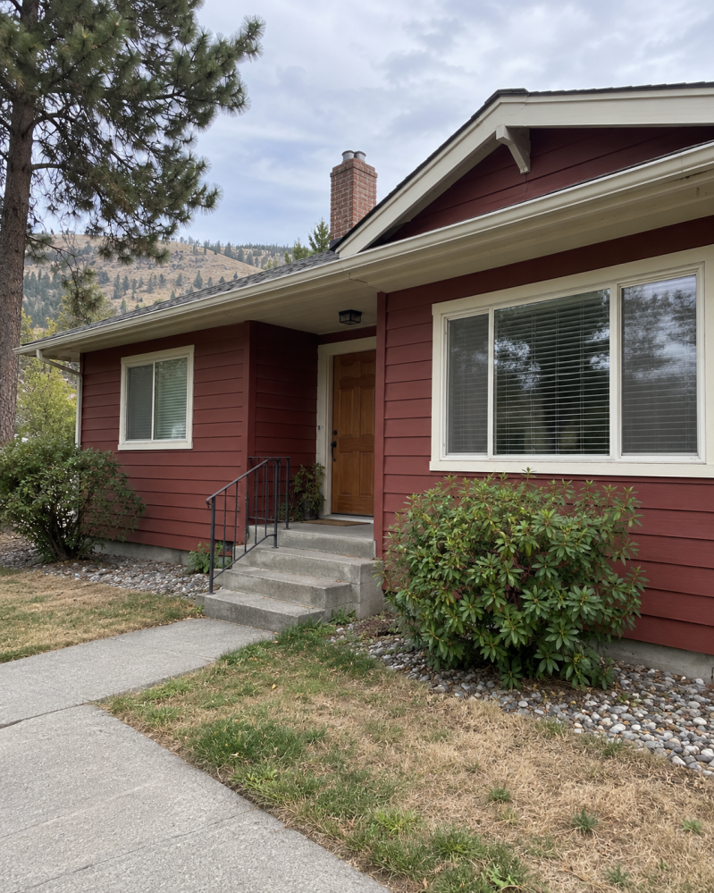Red siding and white trim