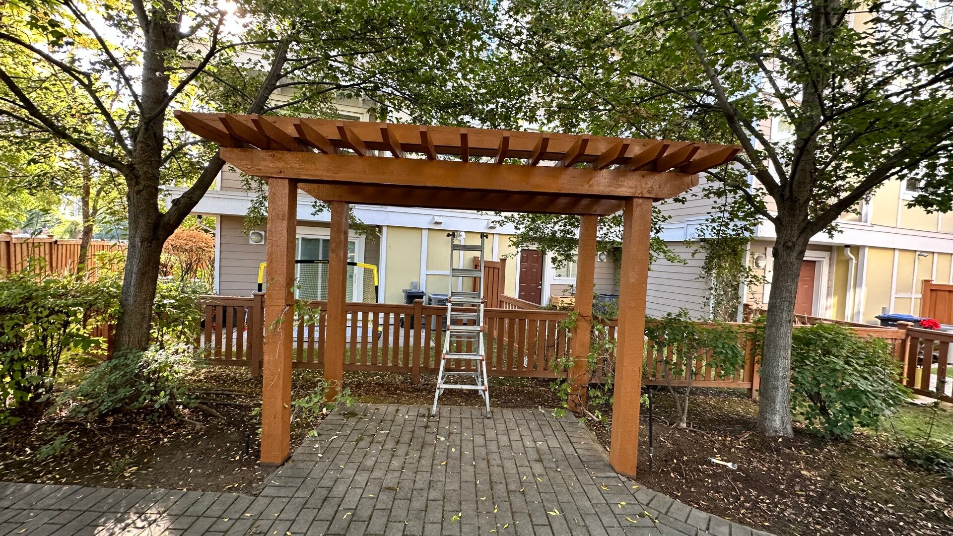 Wood pergola and posts with a warm finish